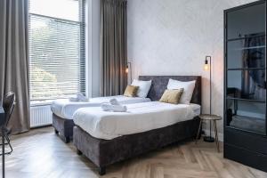 Giường trong phòng chung tại Xxl Loft With Bath Located Stadsvilla +37 ảnh