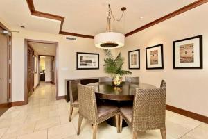 a dining room with a table and chairs at Ocean Tower 503 at Ko Olina in Kapolei