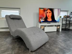 TV a/nebo společenská místnost v ubytování GLEIS 13 - THE LOFT im ehemaligen Lokschuppen