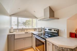 a kitchen with a sink and a stove top oven at Victorian Carpinteria Apartment Less Than 1 Mi to Beach! in Carpinteria