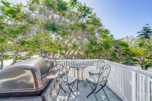 a patio with a table and chairs on a fence at Victorian Carpinteria Apartment Less Than 1 Mi to Beach! in Carpinteria
