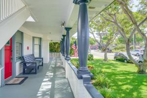 a porch of a house with a red door at Victorian Carpinteria Apartment Less Than 1 Mi to Beach! in Carpinteria