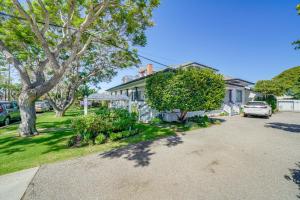 a house with a car parked in the driveway at Victorian Carpinteria Apartment Less Than 1 Mi to Beach! in Carpinteria