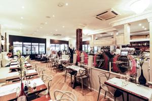 a restaurant with tables and chairs and a bar at Boutique Hôtel Edmond's in Cap d'Ail +34 photos