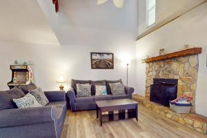 a living room with a couch and a fireplace at SEA STAR in Cape Canaveral