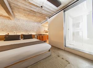 Una cama o camas en una habitación de Hotel Carlota