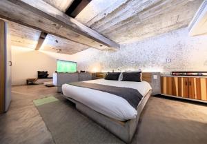 Una cama o camas en una habitación de Hotel Carlota