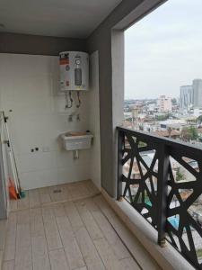 a bathroom with a sink and a view of a city at CoWorking in Corrientes +9 photos