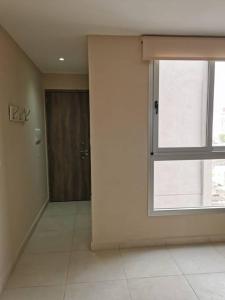 an empty room with a window and a door at CoWorking in Corrientes