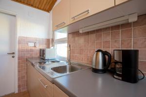 a kitchen with a sink and a counter top at Sunset Holiday3 in Njivice