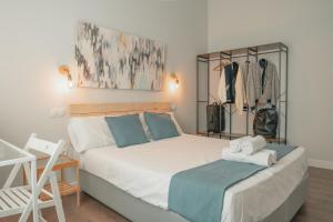 a bedroom with a large bed and a closet at CH Barco in Madrid
