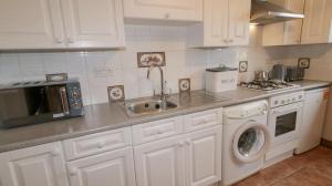 Kuchyň nebo kuchyňský kout v ubytování Breezy Point Accommodation + 14 fotografií