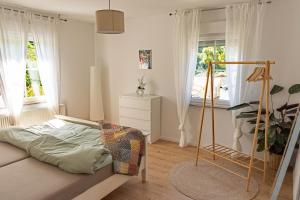 a bedroom with a bed and a window at 70qm Pure Erholung in bester Lage in Idar-Oberstein
