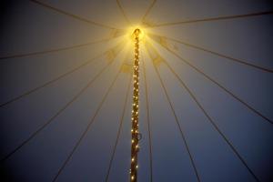 a light pole with christmas lights on it at Glamping Meadow Bell Tent in Stithians