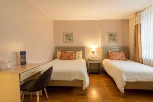 Voodi või voodid majutusasutuse Hotel Sandmelis toas