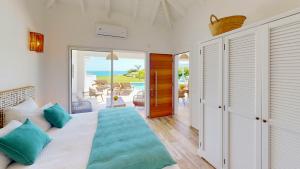 Ένα ή περισσότερα κρεβάτια σε δωμάτιο στο SUNSEEKER SXM - Luxury Guest House 4 stars - Amazing Sea View Pinel - Tintamarre +90 φωτογραφίες