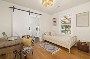 a bedroom with a desk and a bed with a window at Chase House at Low-Key Croft - Hot-tub - Firepit in West Fork