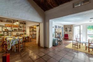 a restaurant with tables and chairs in a room at Casa Bernardina B&B in Tilcara
