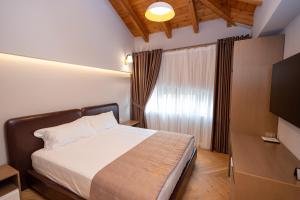 Postel nebo postele na pokoji v ubytování Hotel Vila 101-New Bazaar