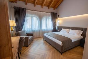 Postel nebo postele na pokoji v ubytování Hotel Vila 101-New Bazaar