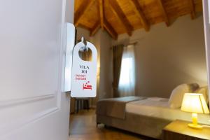 Postel nebo postele na pokoji v ubytování Hotel Vila 101-New Bazaar