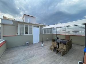 a balcony of a house with a table and chairs at B&b Sant'Anna in Ercolano