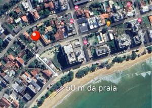 a map of a beach with two red circles at Apartamento recantoazul es Conforto Total a 50m do Mar Apartamento Recém-Reformado na Praia de Castelhanos, ES, para 7 Pessoas Aconchegante e Completo, com 3 Quartos e 1 Suíte in Anchieta +34 photos