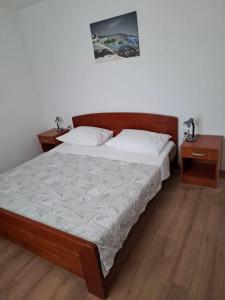 Postel nebo postele na pokoji v ubytování Apartment Drace 4550a