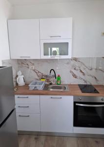 Kuchyň nebo kuchyňský kout v ubytování Apartment Drace 4550a