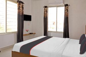 Super Collection O Mountain View Resort客房内的一张或多张床位