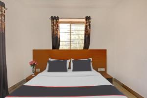 Super Collection O Mountain View Resort客房内的一张或多张床位