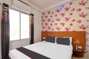 Super Collection O Mountain View Resort客房内的一张或多张床位