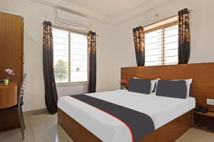 Super Collection O Mountain View Resort客房内的一张或多张床位