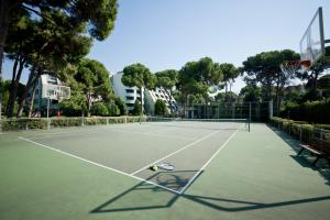 a tennis court with a tennis racket on it at Limak Atlantis Deluxe Hotel Belek in Belek
