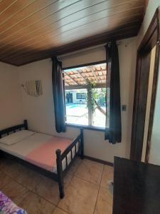 Cama ou camas em um quarto em Pousada Roça Velha