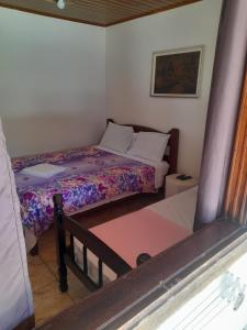 Cama ou camas em um quarto em Pousada Roça Velha