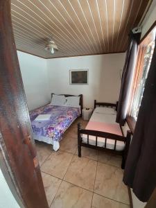 Cama ou camas em um quarto em Pousada Roça Velha
