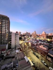 a view of a city with buildings and cars at GRAN NIVEL EN El CENTRO DE NEUQUEN 1 DORMITORIO CON COCHERA OPCIONAL in Neuquén