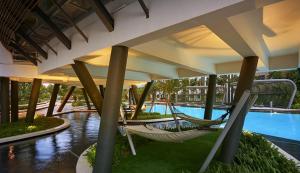 a resort with two hammocks and a swimming pool at M Centura Sentul KL Fully Air Con Blissful Suite KL in Kuala Lumpur +20 photos