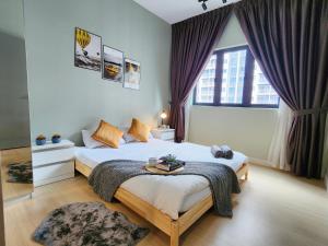 a bedroom with a bed and a large window at M Centura Sentul KL Fully Air Con Blissful Suite KL in Kuala Lumpur