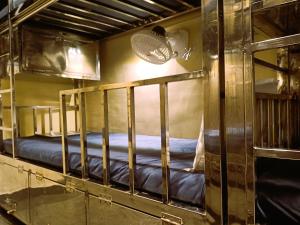 a bunk bed room with two bunk beds in it at The Aroma Backpackers in Mumbai