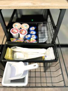 a shelf with food and utensils on a table at Starlight Stays in Manning +12 photos