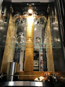 a display of wine glasses on a shelf at MG suite 23 in Beausoleil +33 photos