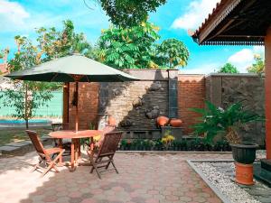 Un pato o zona al aire libre en Kamulyan Heritage Syariah