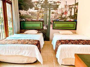 Una cama o camas en una habitación de Kamulyan Heritage Syariah