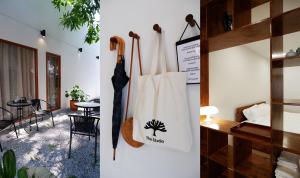 a room with a white tote bag and a table at The Studio in Loei