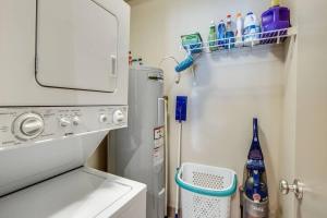 a small refrigerator in a kitchen with a sink at The Lofts of Downtown (540 N 2nd St, #211) in Clarksville +36 photos