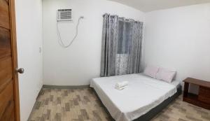 Postel nebo postele na pokoji v ubytování Hidden Gem Siargao