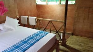 Letto o letti in una camera di Sigiriya River Side Villa