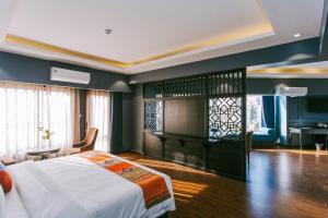 Postel nebo postele na pokoji v ubytování Sapa Charm Hotel